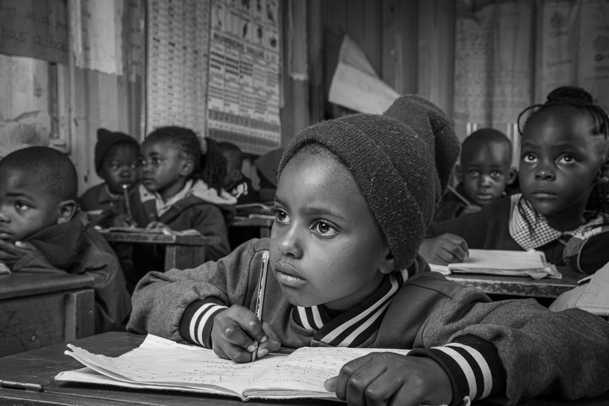 Children focus on their lessons inside the classroom.