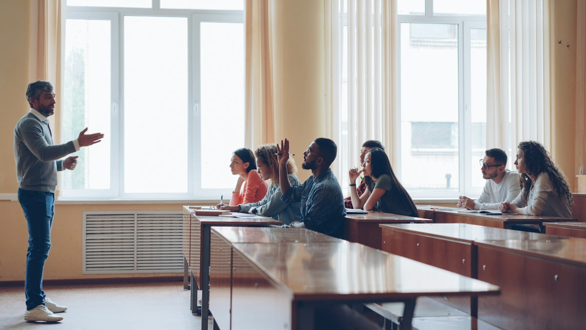 Professor lecturing to students in a classroom setting